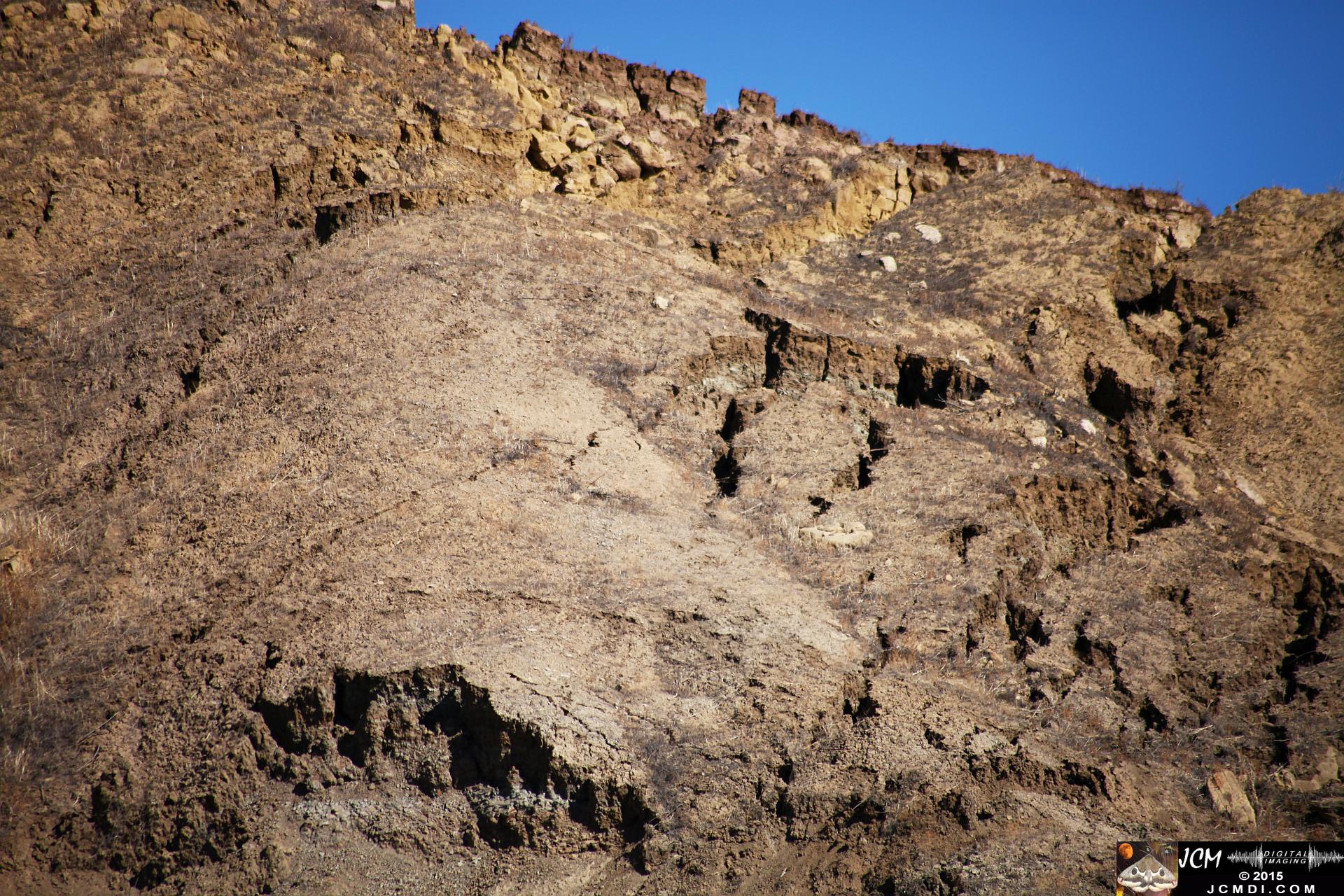 Landslide, buckled pavement, and terrain at Vasquez Canyon Road in Santa Clarita, CA filmed 11-25-2015